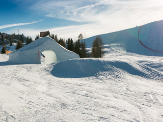 frozen tunnel, snowpark in dolomites mountains