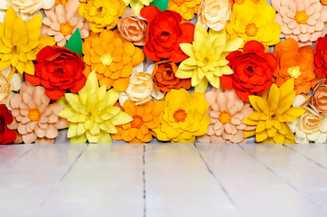 Origami. Colored background, flowers made of paper
