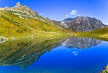 Fototapeta na wymiar Mountain lake like the mirror, Caucasus, Russia