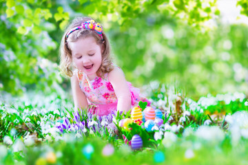 Adoraable little girl at egg hunt
