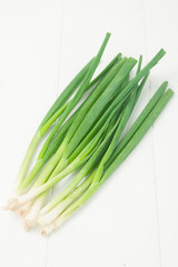 green onions on white background