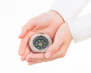 Woman holding small compass. Isolated in a white background. © kozirsky