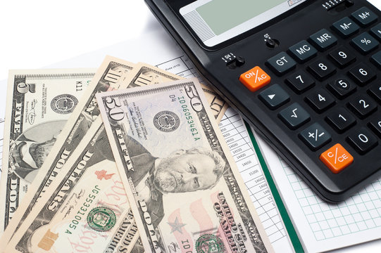 Calculator and money on a notepad. Background image for finance