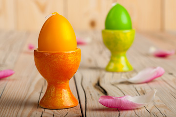 Easter egg shaped candles on the stand