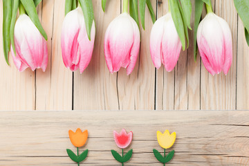 Pink tulips in a row and small decorative tulips