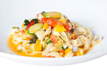 pasta with vegetables on a white plate