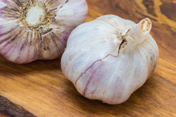 Organic garlic on wooden table background