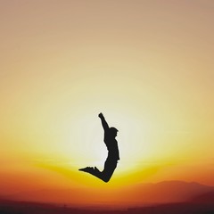 dancer jumping in sunset
