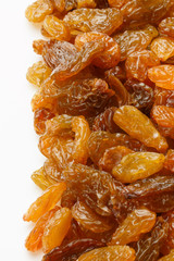 Yellow sultanas raisins isolated on white background cutout