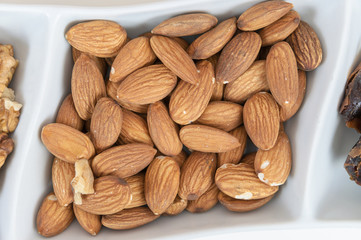 Almonds in a white dish