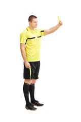 Football referee showing a yellow card