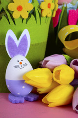 Happy Easter egg hunt baskets with tulip flowers 