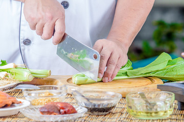 chef cutting kale