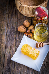 honey dipper and honeycomb, nuts of various kinds