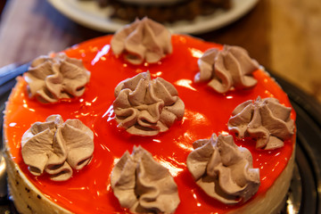 red cake detail in wooden table