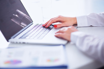 Young businesswoman working on a laptop