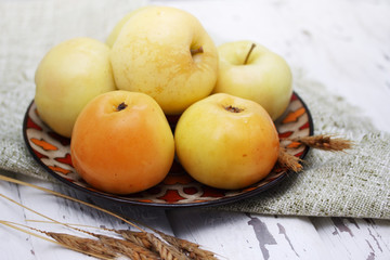 Cask apples on a white board
