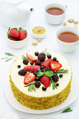 pistachio cake with berry compote and rosemary mousse