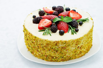pistachio cake with berry compote and rosemary mousse