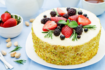 pistachio cake with berry compote and rosemary mousse
