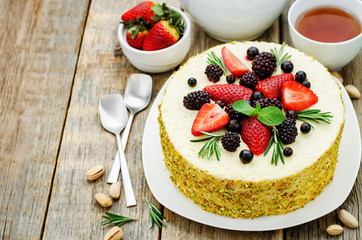 pistachio cake with berry compote and rosemary mousse