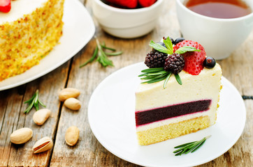 pistachio cake with berry compote and rosemary mousse