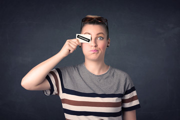 Pretty girl with censored paper sign