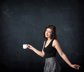 Businesswoman holding a white cup