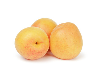 three ripe apricot fruits isolated