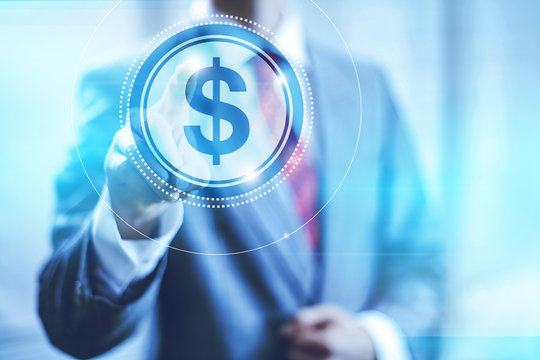 Businessman pointing towards camera selecting dollar