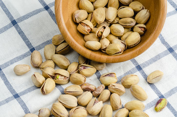 roasted and salted pistachios on table cloth