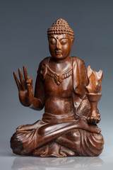 wooden, polished statue of Buddha