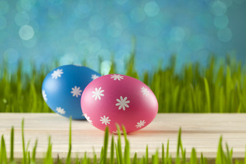 Colored Easter eggs on blue sky background