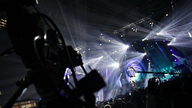 Television production on the set of a large rock concert