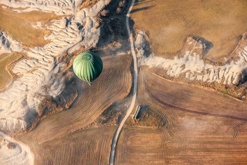 Air baloon landing over grow fields