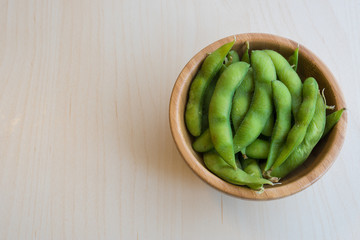 Japanese green soy bean on the wooden table.