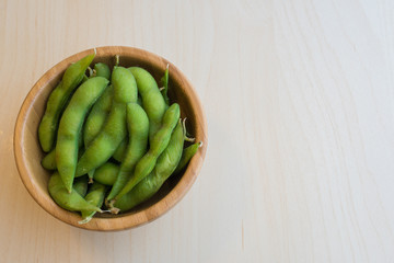 Japanese green soy bean on the wooden table.
