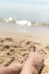 sandy feet on the beach