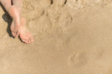 sandy feet on the beach