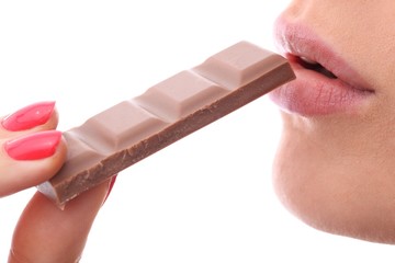 woman eating chocolate - mouth and hand (cutout)