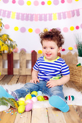 beautiful boy with Easter eggs