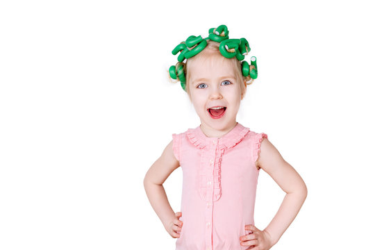 beautiful girl with hair curlers isolated