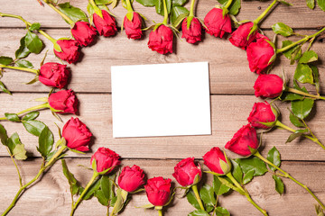 Roses arranged on old wooden background