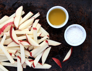 Raw French fries with oil and salt