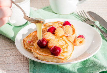 add vanilla pancakes with cherry and raspberry