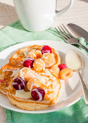 pancakes with cherry, raspberry and vanilla sauce