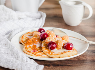 pancakes with cherry, raspberry and vanilla sauce