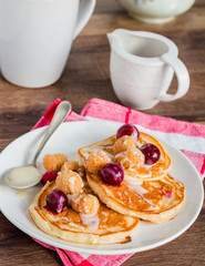 pancakes with cherry, raspberry and vanilla sauce