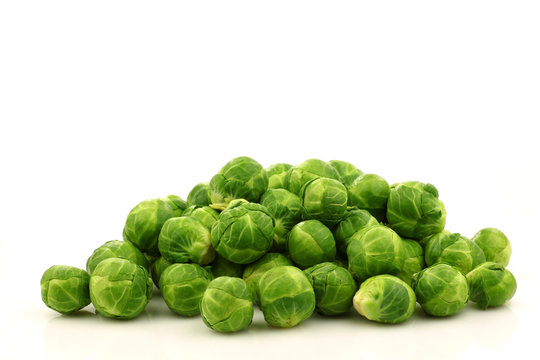 Freshly harvested Brussel sprouts  on a white background