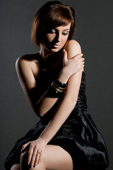 Fototapeta premium elegant fashionable woman in black dress